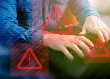 crop-person-using-laptop-symbols-error-min