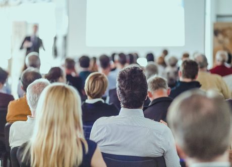 rear-view-unrecognizable-people-audience-conference-hall-min